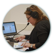 A Standardized Technical Communicator working with students during a simulation.